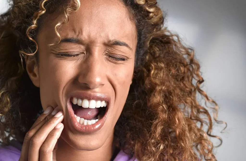 woman feeling teeth pain