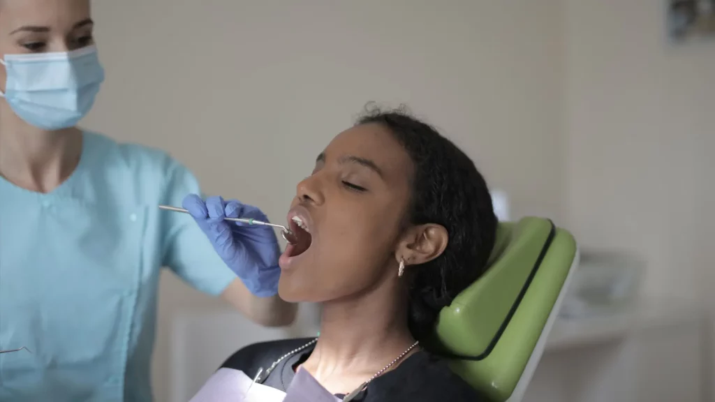Woman getting a checkup at the dentist