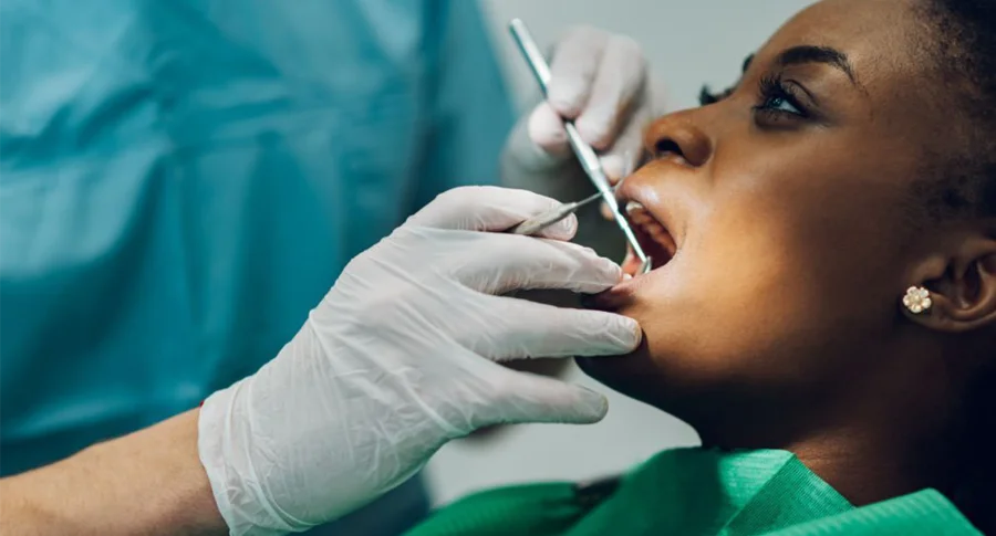 woman getting oral examination at the dentist